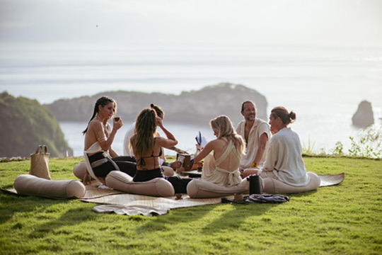 Tea circle on a grass cliff above the ocean