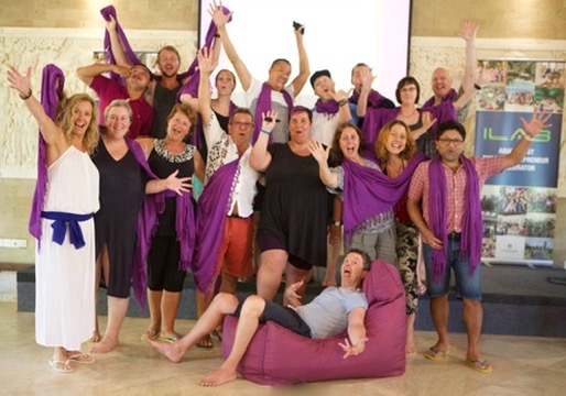 An event ending — hands up, joy in the room