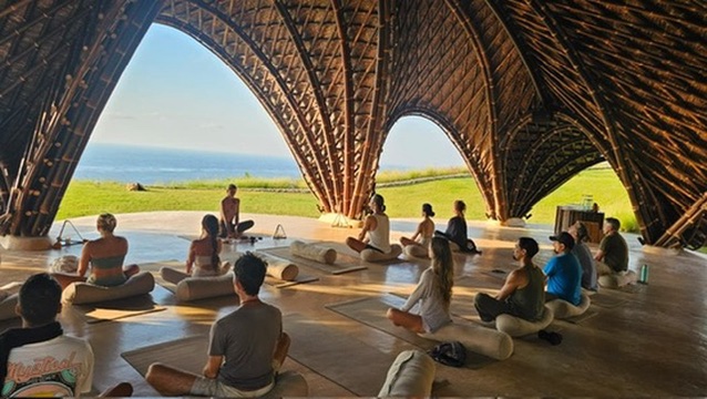Bamboo dome meditation overlooking the ocean at sunrise