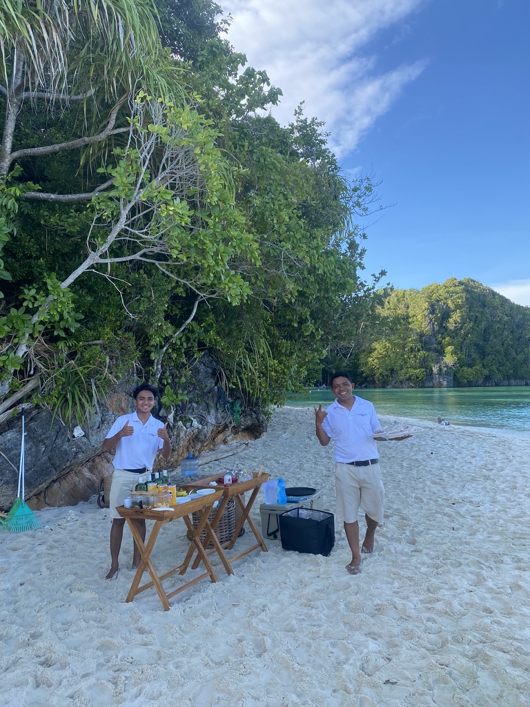Bridge hosts setting a beach picnic