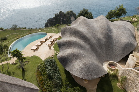 Sculptural shell-roof villa with infinity pool