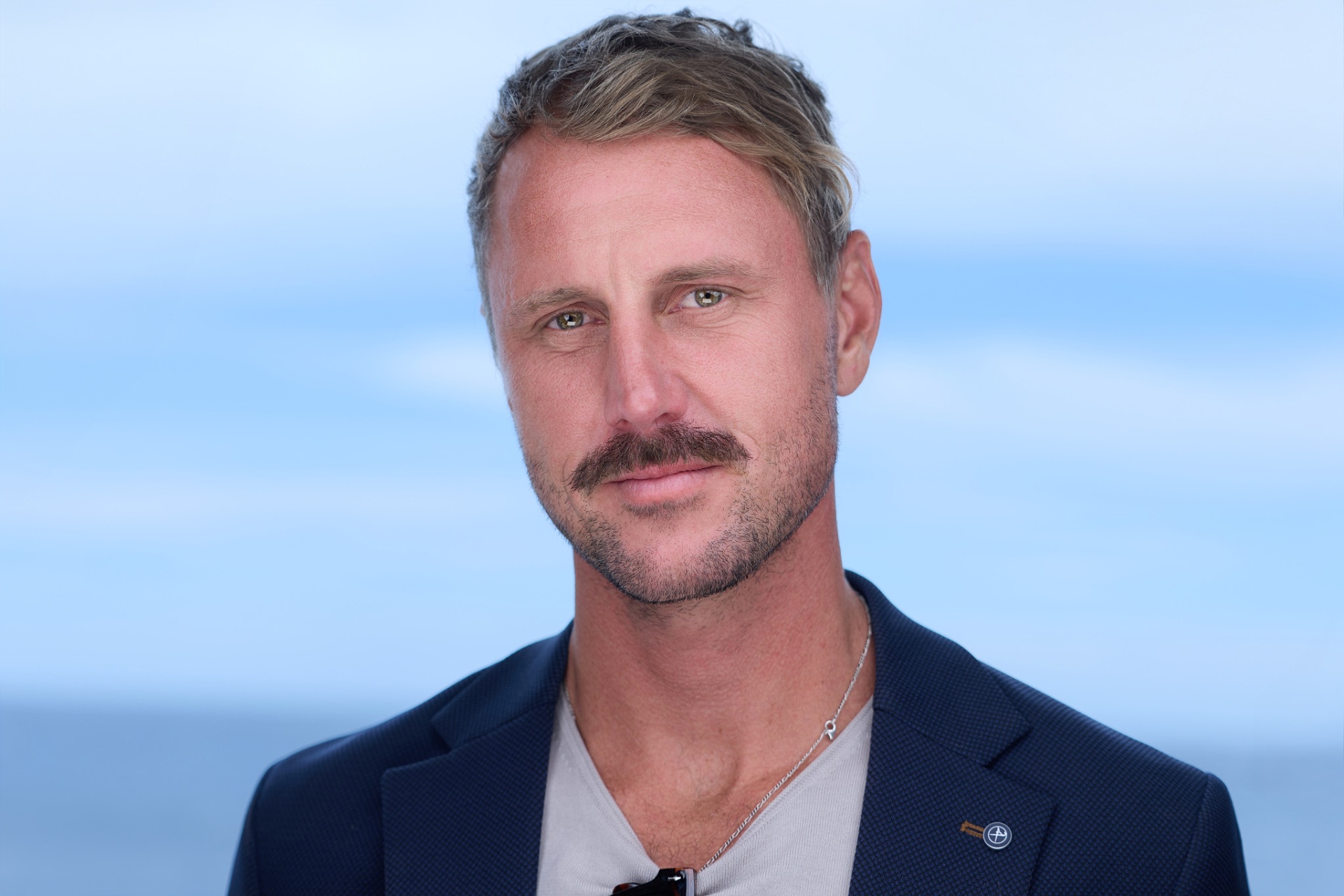 Rory Callaghan headshot, calm, navy jacket